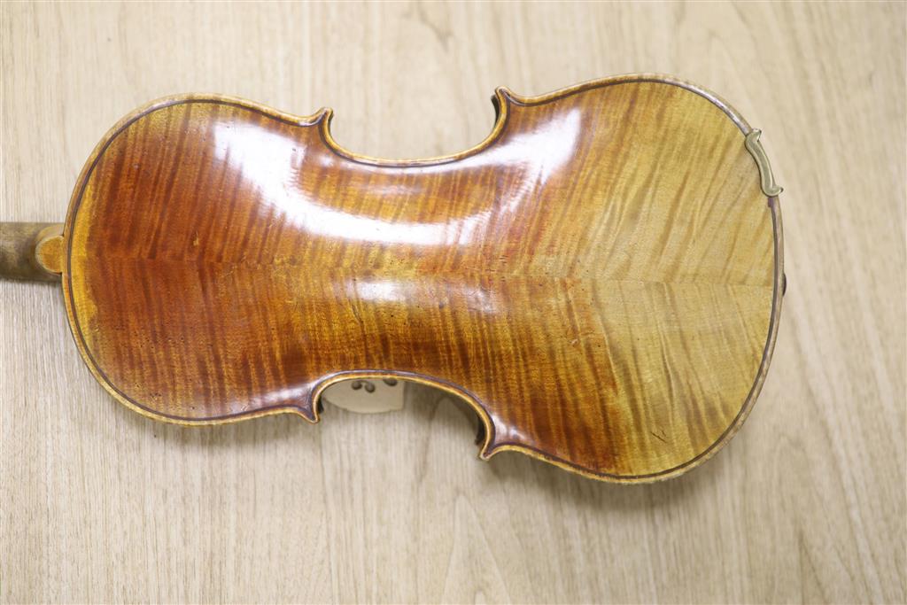 A late 19th century violin and a bow, cased